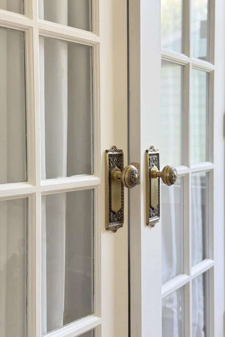 French-doors-on-bedroom-closet-with-white-curtains