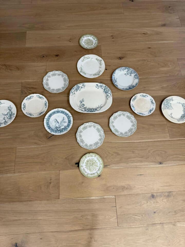 lay-out-dishes-on-floor-before-hanging-on-the-wall for a plate wall display