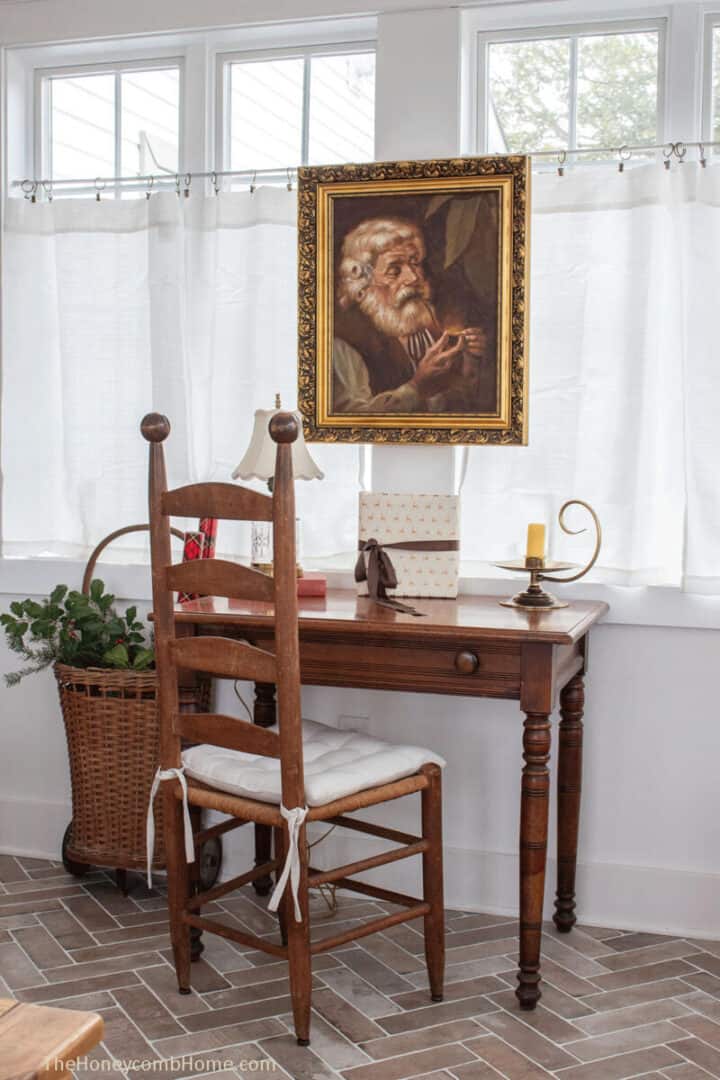 Antique-Santa-painting-over-vintage-writing-desk-Christmas-decorating-ideas