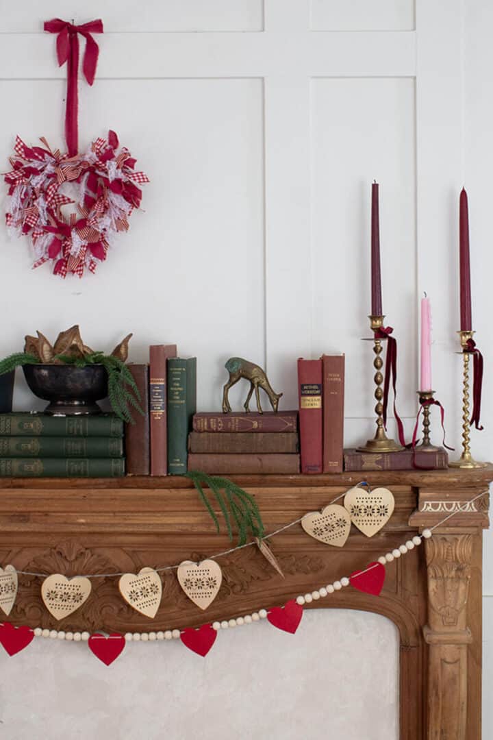 PIN-Valentine's-wreath hanging over mantel with Valentine's decorations